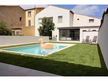 maison de plain-pied 140 m²   jardin à jouissance exclusive  piscine  garage