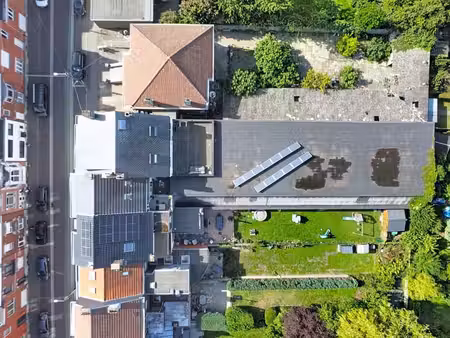 immeuble de rapport garage 20 places  entrepôt et 2 apparts)