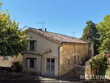 a vendre maison en pierre de 171 m² avec jardin arboré au coeur du village de mouchan.