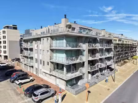 centraal gelegen gelijkvloers appartement met garage in o...