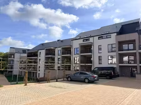 blancs prés - apt 1 ch neuf avec balcon et parking intérieur