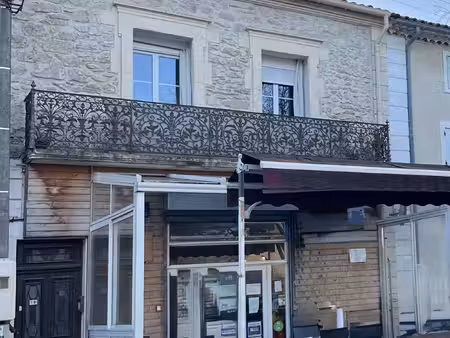 immeuble : appartement + murs commerciaux