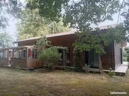 maison ossature bois sur terrain arborée