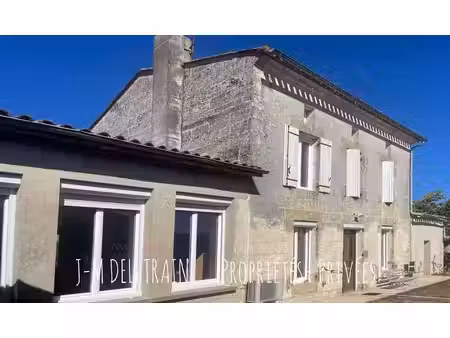 maison en pierre 180 m² vaste pièce de vie 70 m² et préau attenant  potentiel atelier/bure