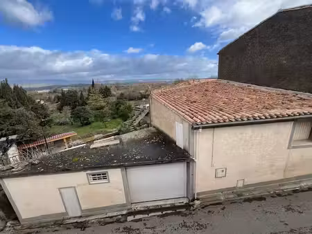 maison de village avec ascenceur   garage et terrasse