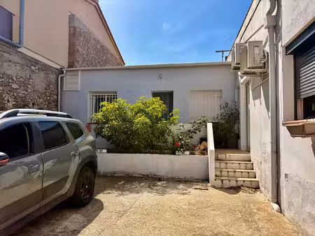 appartement de plain-pied 2 pièces avec terrasse et place de