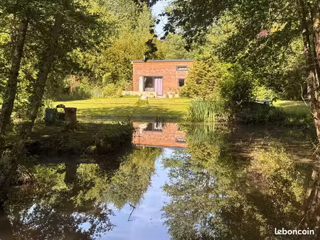 chalet tout confort sur terrain avec rivière et étang