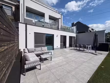 appartement de r-d-c économe en énergie avec jardin  situé a