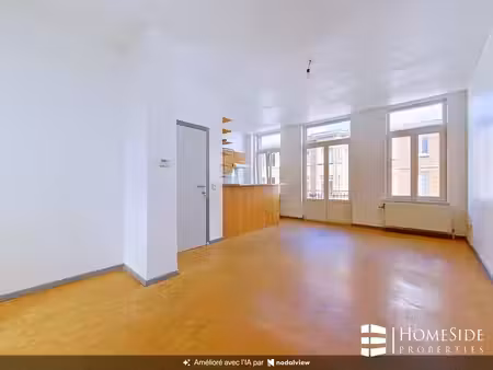 appartement +/-60m² + terrasse - faibles charges communes!!