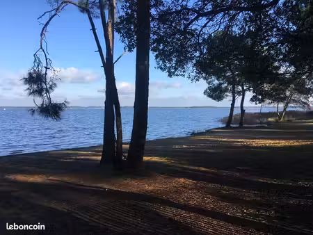 belle maison en bois sur lacanau lac coté longarisse en face du moutchic