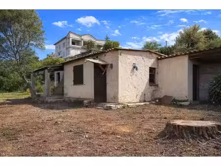 terrain avec maison à régulariser