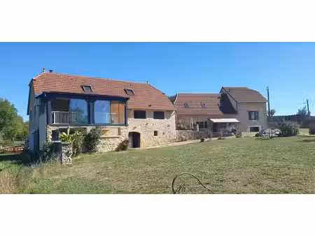 1622-superbe ensemble en pierres comprenant une grange entièrement renovée en loft et sa..