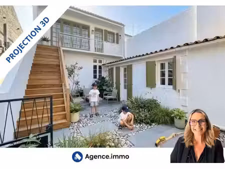 maison duplex avec un local pro loué et garages