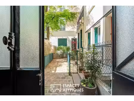 duplex inversé en cour anglaise arborée  au coeur de l'île de la jatte