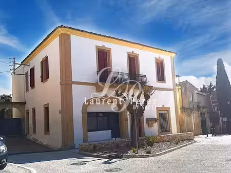 immeuble 5 appartement et un local à mus