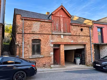 bâtiment (garage) dans le centre ville de saint-hubert