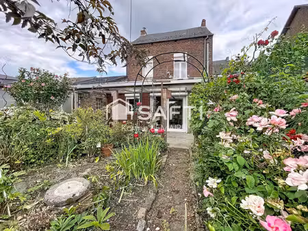 beau potentiel pour cette maison avec garage et beau jardin