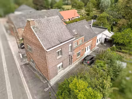 te renoveren woning met werkplaats en ruim perceel in landelijke omgeving te londerzeel.