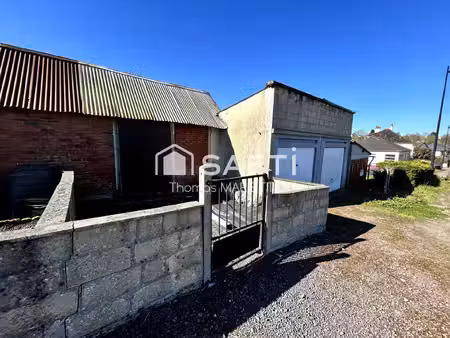 garage avec cave  remise et terrasse