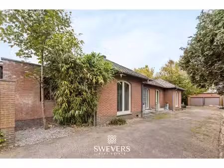 vrijstaande gelijkvloerse woning met drie slaapkamers te zonhoven