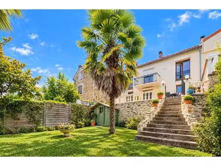 maison à osny : cocon au rez-de-chaussée  vie de réception en souplex et jardin en cascade