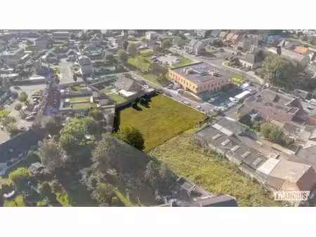 perceel van 438m² bouwgrond voor halfopen bebouwing in cent…