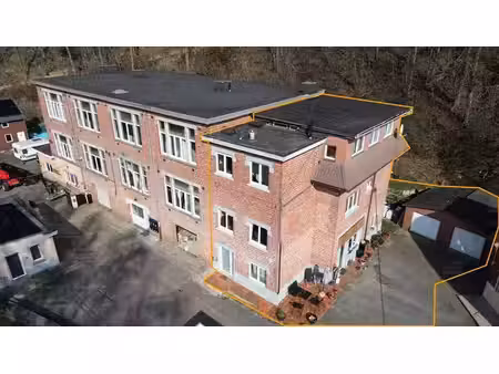 immeuble de rapport composé de 3 appartements et 2 garages