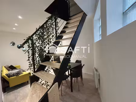 immeuble de rapport composé d'un local commercial et de deux logements