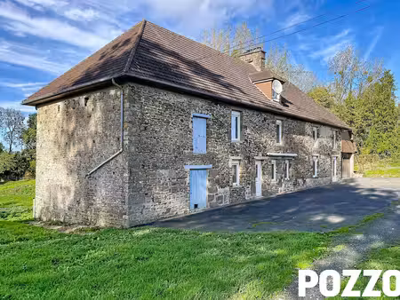 a vendre. guilberville. maison en pierres de 200 m² avec plus de 3 ha et dependances.