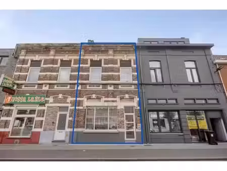 instapklare eengezinswoning met 3 slaapkamers en deels overdekte koer  gelegen op fietsafs