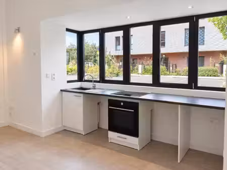 t2 en duplex avec parking et jardin à st andre lez lille