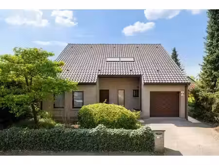 ruime en degelijke open woning met inpandige garage en grote zuidwest georiënteerde tuin o