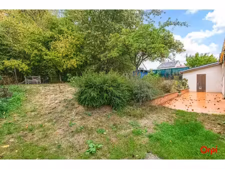 maison familiale de 110 m² avec grand jardin et garage à romain