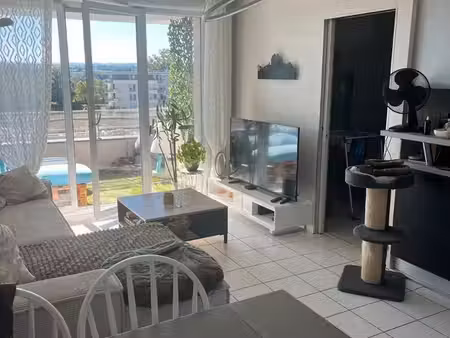 rodez bourran t3/4 traversant avec balcon-terrasse plein sud  piscine et 2 places de parki
