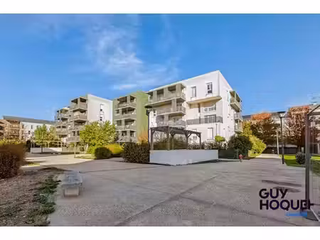 appartement 3 pièce(s) 58.45 m2 avec jardin  place de parking et local poussette privatif 